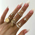 products/12-Pcs-set-Bohemian-Vintage-Crown-Water-Drops-Stars-Geometric-Crystal-Ring-Set-Women-Charm-Joint.jpg_640x640_6072e039-0733-4a66-bf3a-7a2aedc81ec3.jpg